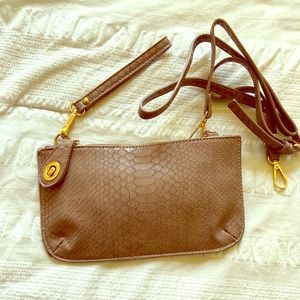 Blush pink wristlet with cross body strap